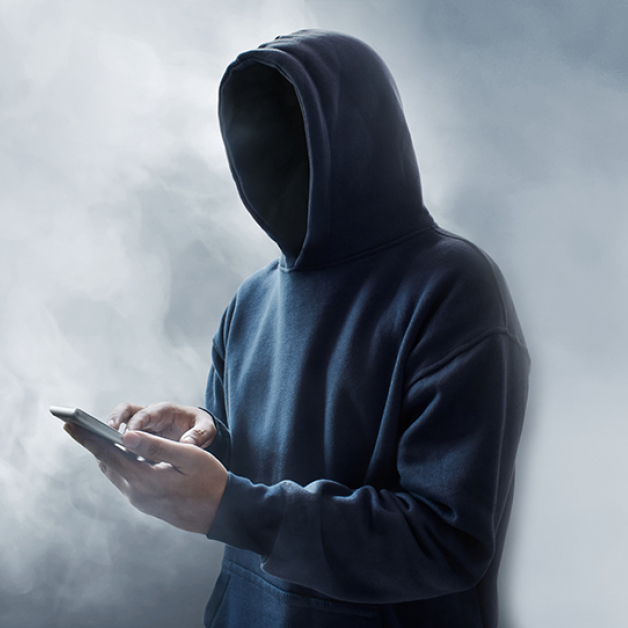 Man with hoodie and phone